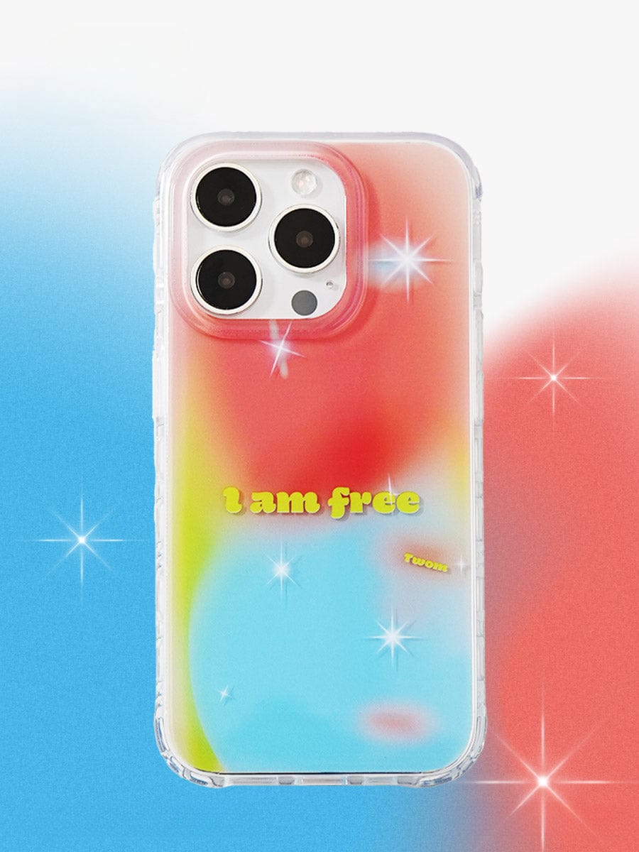 A smartphone encased in the "I Am Free Gradient iPhone 16 Pro Max Case | Vibrant Colorful Design | Reflective All-Inclusive Protective Cover," showcasing a gradient background of blue, red, and yellow. The transparent case is adorned with the text "I am free" in yellow, surrounded by sparkling light effects.