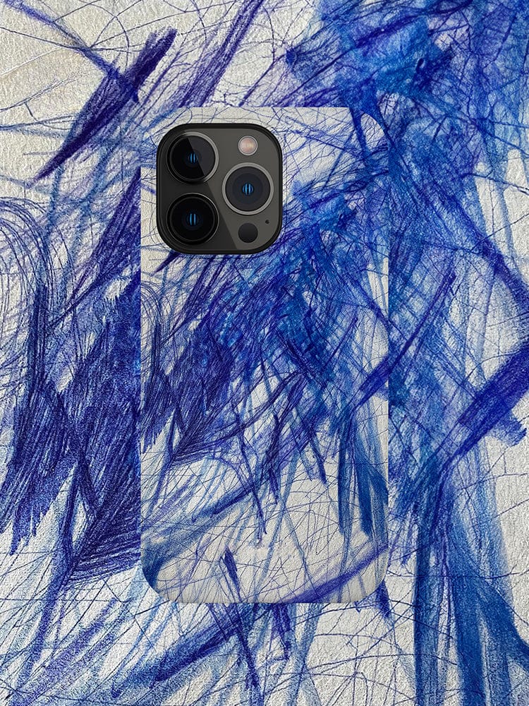 An Abstract Blue Scribble iPhone 16 Pro Max Case - Artistic Design with Full Protection, complete with a camera bump, rests seamlessly on a white surface adorned with blue crayon scribbles. The phone case harmonizes with the scribbles, producing a camouflage effect.