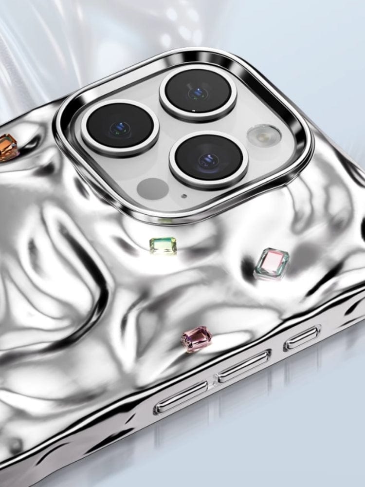 A detailed view of the iPhone 16 Pro Max Luxury Case showcases its metallic, textured design with handcrafted gemstones encircling the camera lenses, providing dual-layer protection and a seamless connection with N52 magnets for MagSafe compatibility.