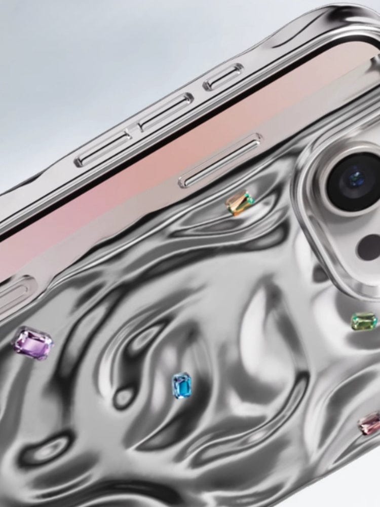 Detailed view of the iPhone 16 Pro Max Luxury Case, showcasing its metallic wavy-pattern design adorned with small colorful gemstones. This case offers dual-layer protection and is crafted from PC material, incorporating N52 magnets.