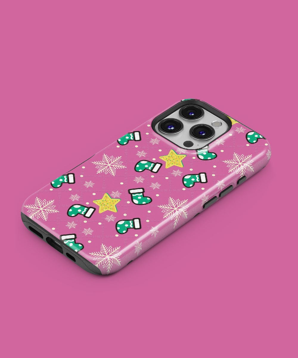 The Festive Stocking iPhone 16 Pro Max Case showcases a delightful holiday design with snowflakes and stars, all set against a vibrant magenta background, and is MagSafe-compatible.