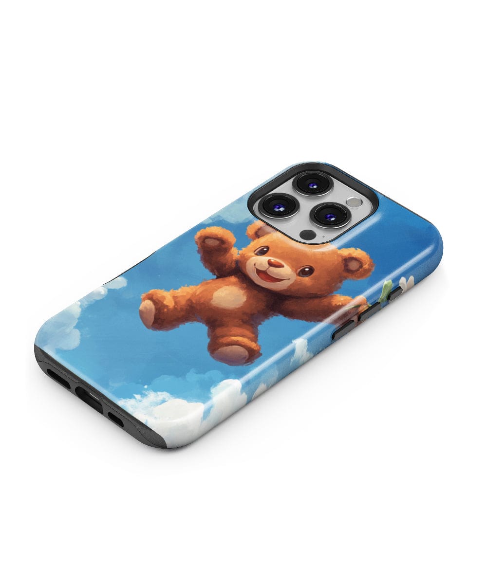 Introducing the Adorable Teddy Bear iPhone 16 Pro Max Case – MagSafe Compatible: a charming design featuring a smiling teddy bear flying among clouds against a serene blue sky. Experience both cuteness and durability with this slim-fit, shockproof PC + silicone dual-layer protection case.