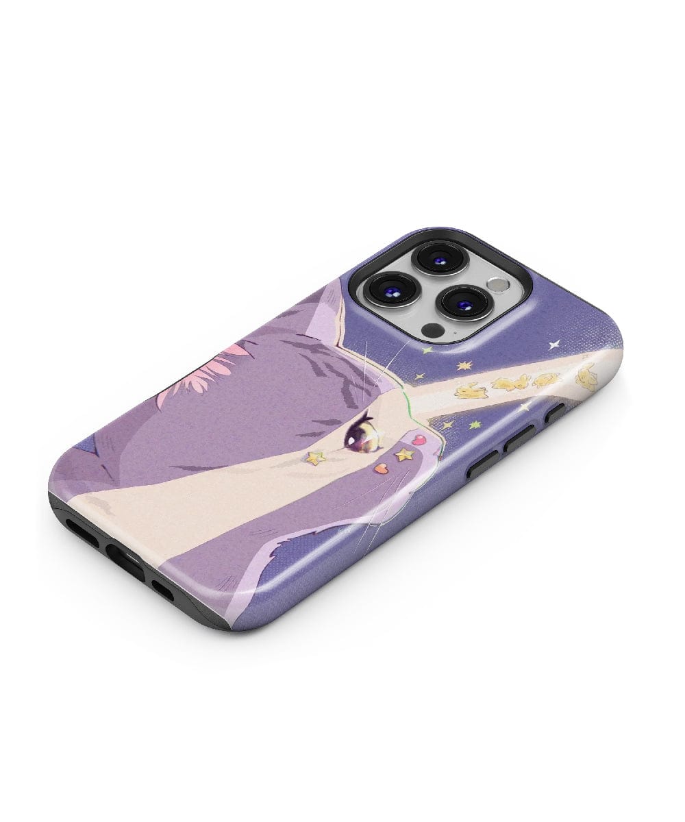 A smartphone lies on its back, encased in the Dreamy Cat with Starbeam iPhone 16 Pro Max Case – Cosmic Cat Design, featuring pastel colors and a cute aesthetic.