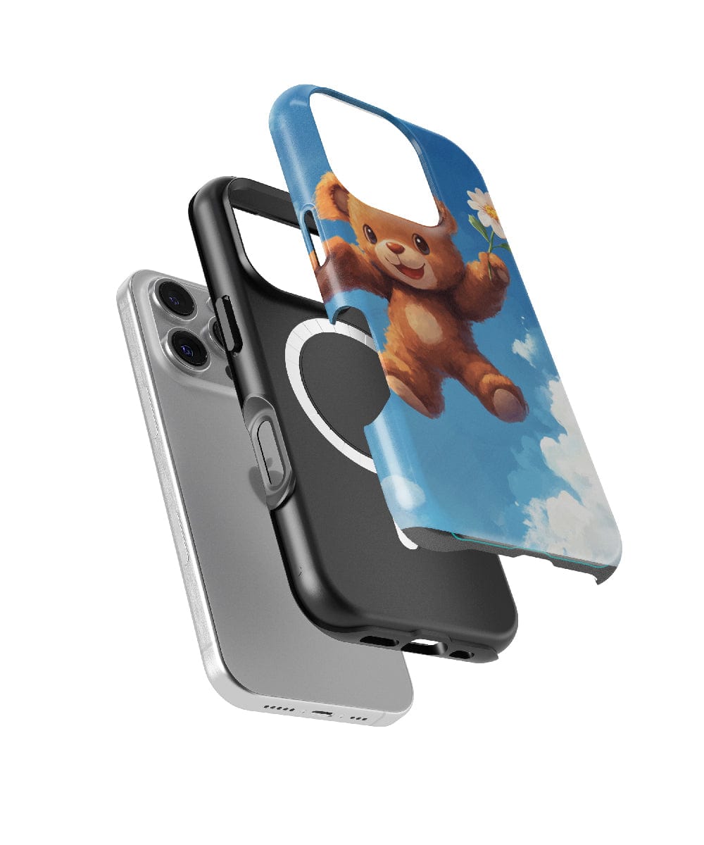 Exploded view of the Adorable Teddy Bear iPhone 16 Pro Max Case, a MagSafe compatible, slim-fit design offering dual-layer protection with a shockproof PC + silicone construction. The case showcases a bear holding a flower against a blue sky background.