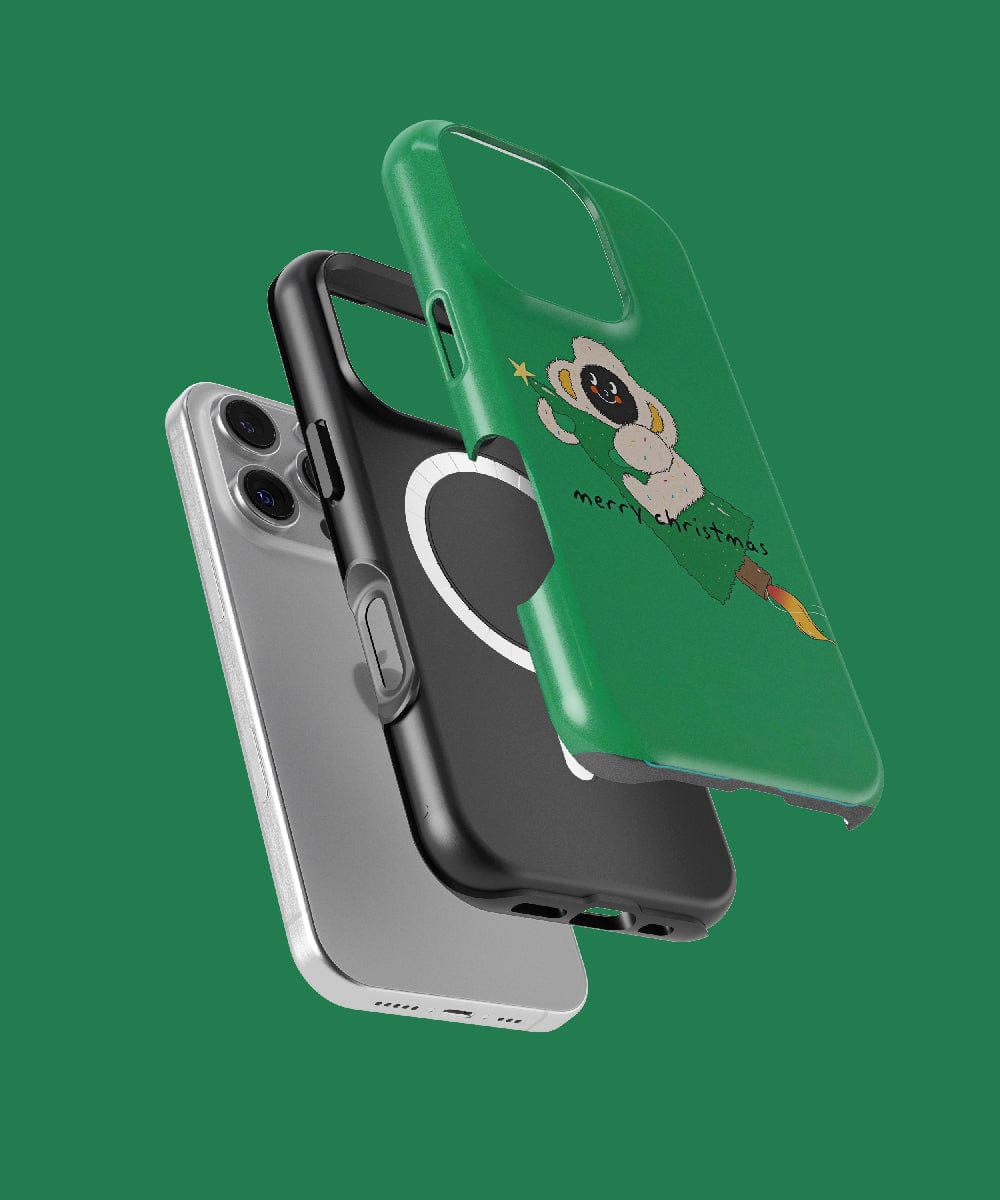 Three overlapping cases for the iPhone 16 Pro Max, each boasting a distinctive design: a MagSafe compatible plain grey case, a black case adorned with a heart, and the Merry Christmas Monkey iPhone 16 Pro Max Case with its festive green holiday theme featuring an adventurous astronaut illustration.