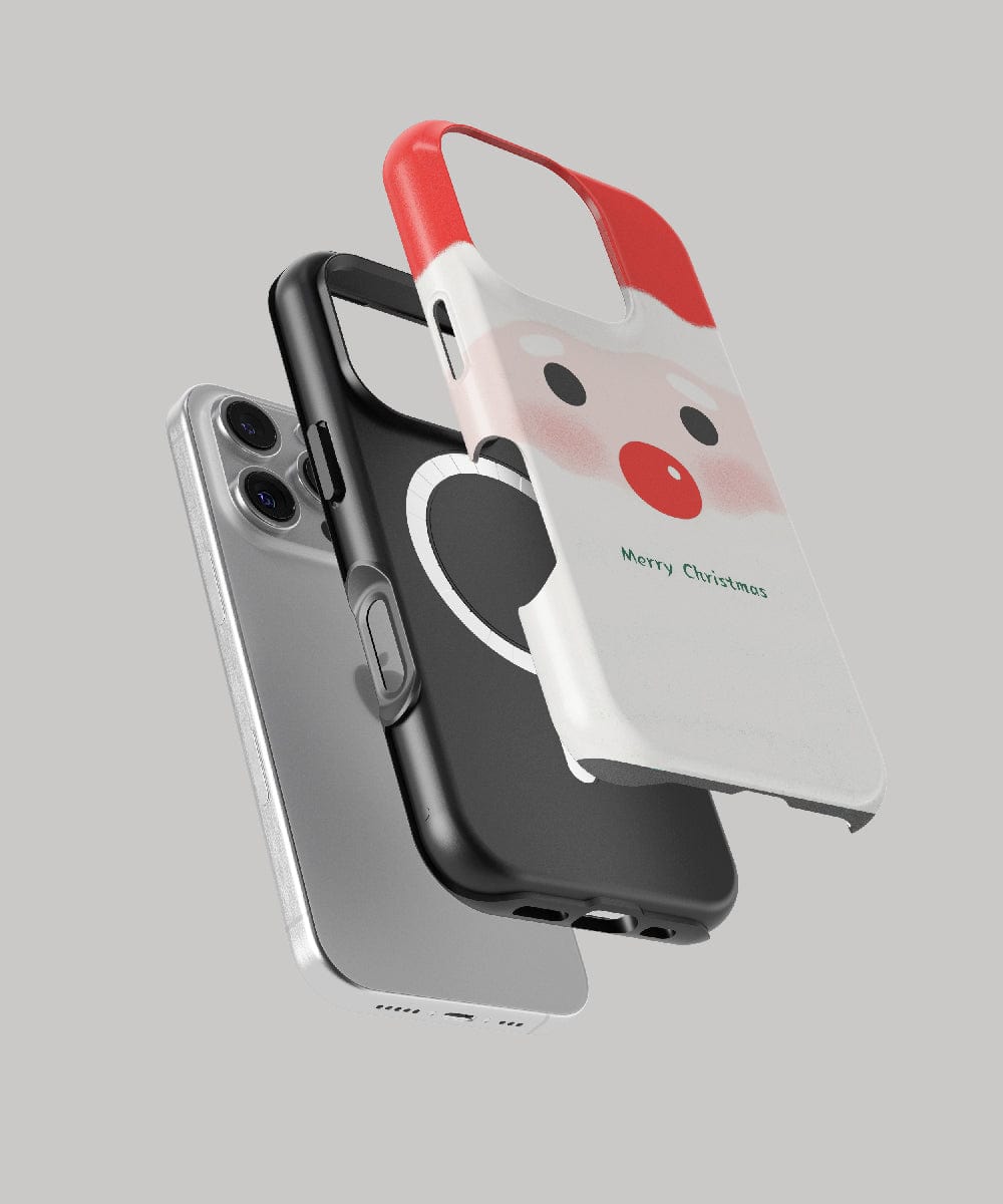 Three iPhone cases gracefully floating in mid-air: a gray one boasting dual-layer protection, a black MagSafe-compatible case with a ring attachment, and the Minimalist Santa iPhone 16 Pro Max Case featuring a cute holiday design in red-and-white, perfect for the festive season.