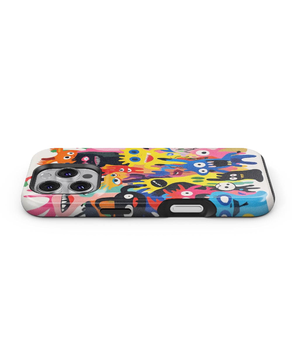 The Quirky Cartoon Monster iPhone 16 Pro Max Case – MagSafe Compatible is shown lying flat, showcasing its multiple eyes and vibrant patterns. Perfectly designed for the iPhone 16 Pro Max, it proudly displays the camera cutout. This slim fit, shockproof PC + silicone cover combines both protection and style effortlessly.