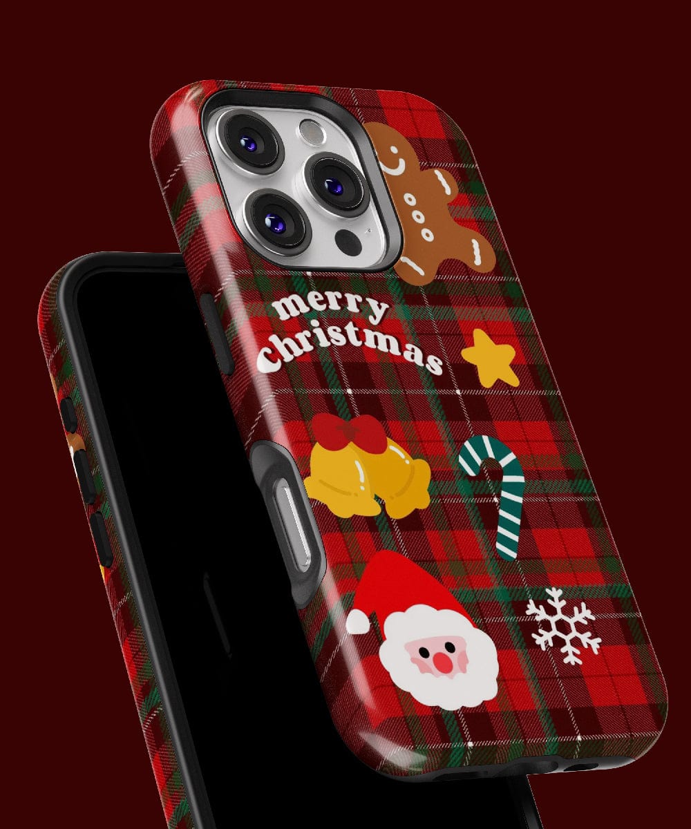 Introducing the Plaid Christmas iPhone 16 Pro Max Case – a classic holiday design featuring a festive red plaid pattern with delightful icons like gingerbread man, pudding, candy cane, Santa face, and snowflake. It provides dual-layer protection and is MagSafe compatible to keep your phone secure while celebrating the holiday spirit.