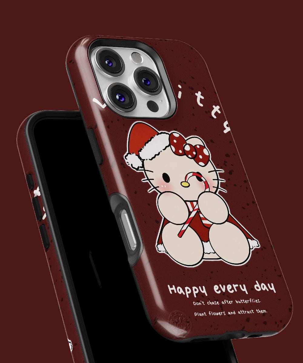 Introducing the Christmas Lucky Kitty iPhone 16 Pro Max Case – Festive Cute Cat Design, which showcases a cartoon cat dressed in a Santa outfit holding a candy cane. Featuring "Happy every day" written on a red background, this MagSafe-compatible case combines holiday charm and functionality for your device.